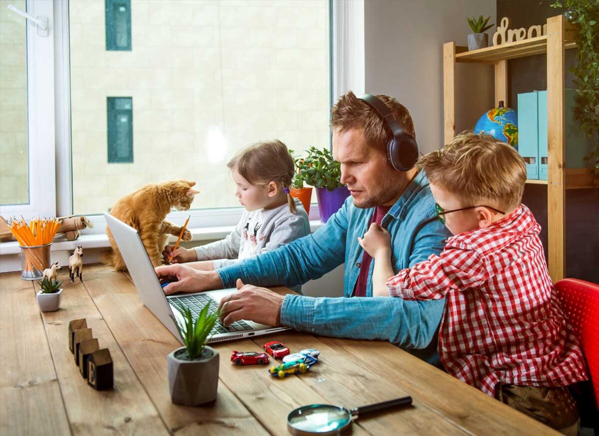 Article image of man working from home with children